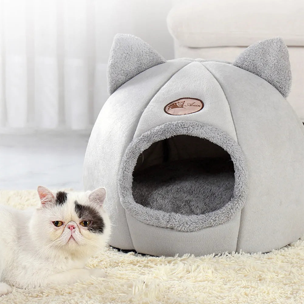 Large grey enclosed sofa-style winter nest cat bed for indoor cats, showing removable fleece lining.