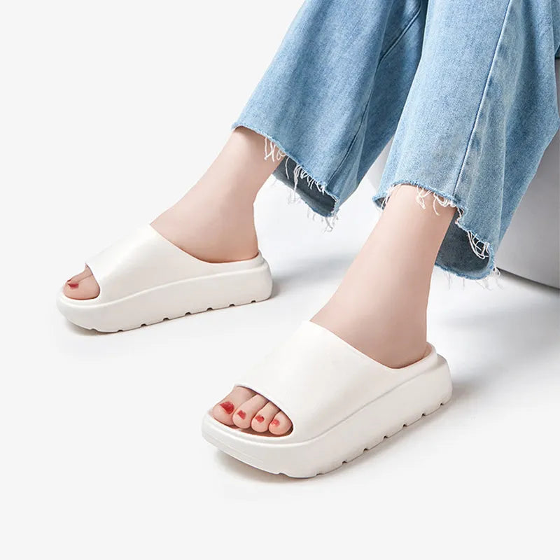 Women's beige fish mouth design beach slippers with a thick 5.5cm EVA sole.