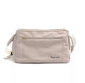 Crossbody bag for small breed dogs up to 10 jin in off-white colour on a neutral background