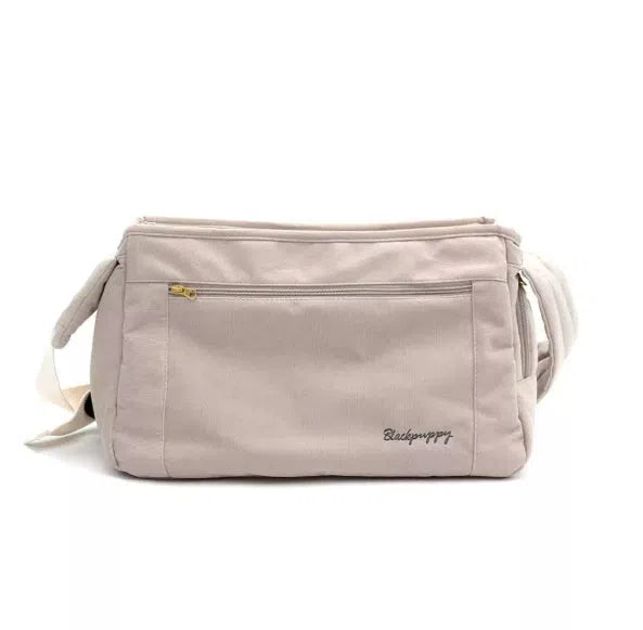 Crossbody bag for small breed dogs up to 10 jin in off-white colour on a neutral background