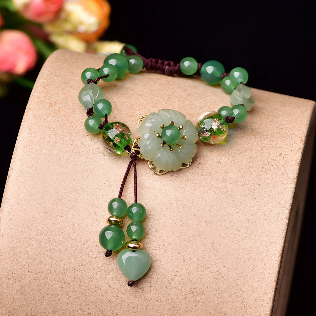 Women's hand-woven bracelet with Chinese auspicious patterns showing flower elements and mixed material texture