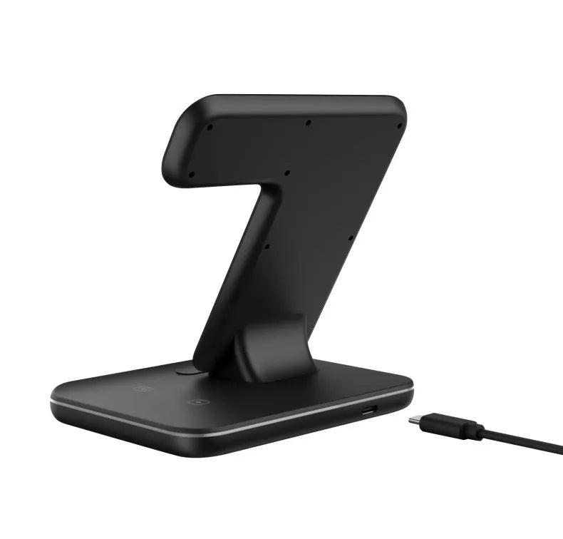 White three-in-one wireless charging stand for mobile phone smartwatch and headset on desktop