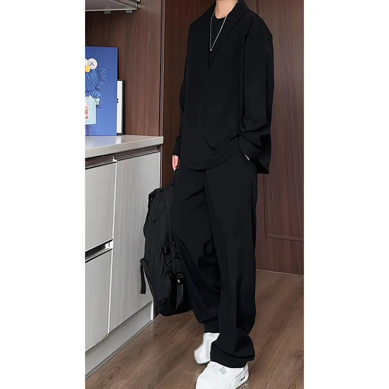 Men's black casual two-piece suit with long sleeve polo shirt and slim fit trousers