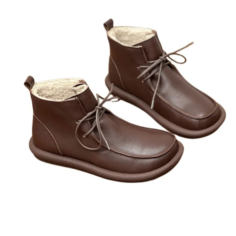 Women's cowhide boots in black and coffee colours with flat heel and round toe design