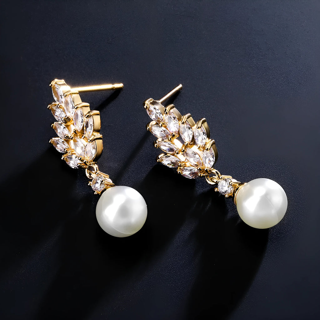 Micro inlaid zircon pearl earrings with geometric floral design in gold, platinum, or rose gold plating.