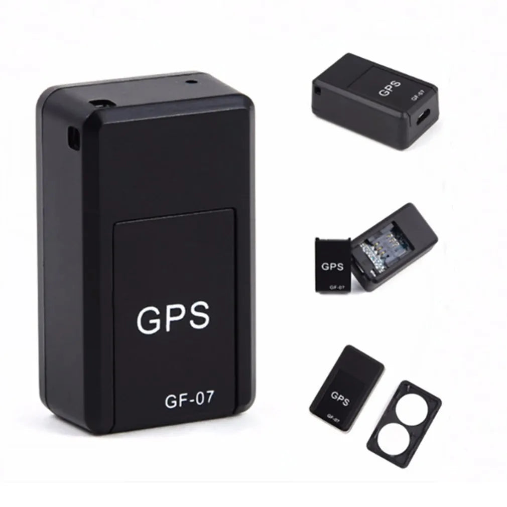 Small black magnetic GPS tracker device shown next to a USB charging cable.