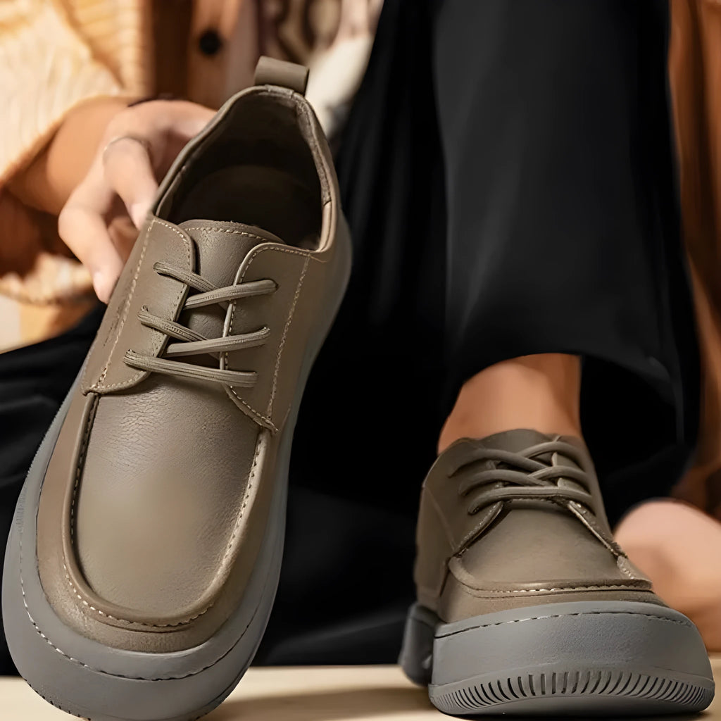 Brown leather retro casual shoes for men with a distinctive big toe design and visible stitching.