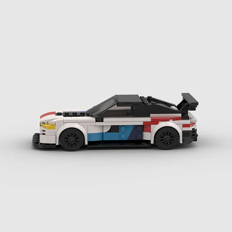 BMW M8 GTE building block car model kit assembled on a flat surface, showing 17cm length and plastic construction