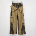 Women's dark khaki leopard print jeans with retro tooling style stitching and straight leg cut