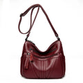Genuine leather shoulder messenger bag in horizontal square shape with multiple internal compartments and single strap