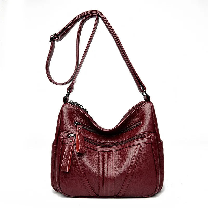 Genuine leather shoulder messenger bag in horizontal square shape with multiple internal compartments and single strap