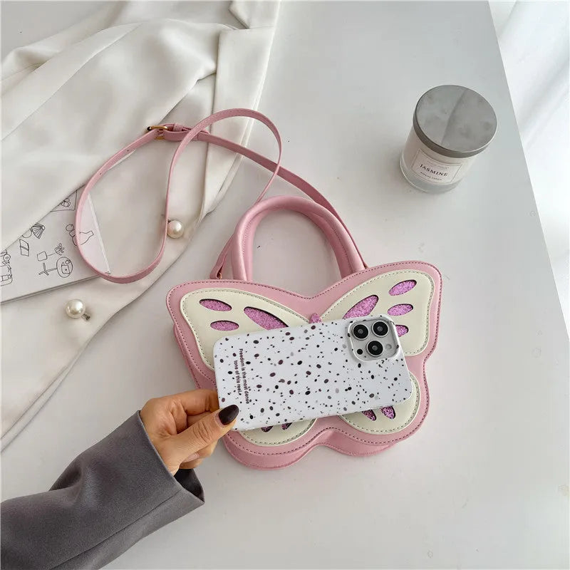 Square crossbody bag in PU material with contrast colour detailing showing white, pink, blue, and black colour options