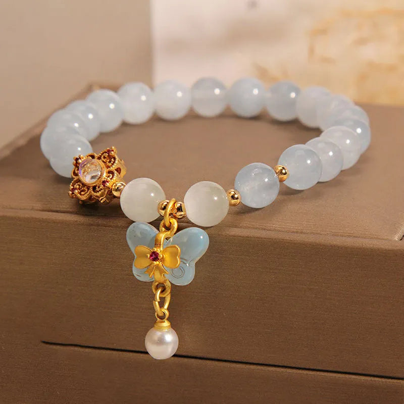 Women's aquamarine butterfly pendant bracelet with crystal and rhinestone details
