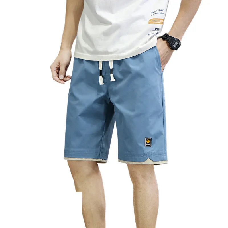 Korean-style loose-fit casual shorts in polyester with micro elasticity, shown in green colour