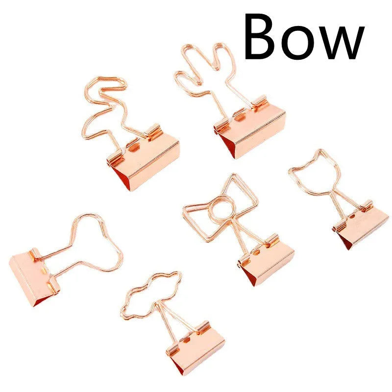 Gold-toned long tail metal office clip with decorative flamingo, love, clouds, cat, cactus, and bow design options.