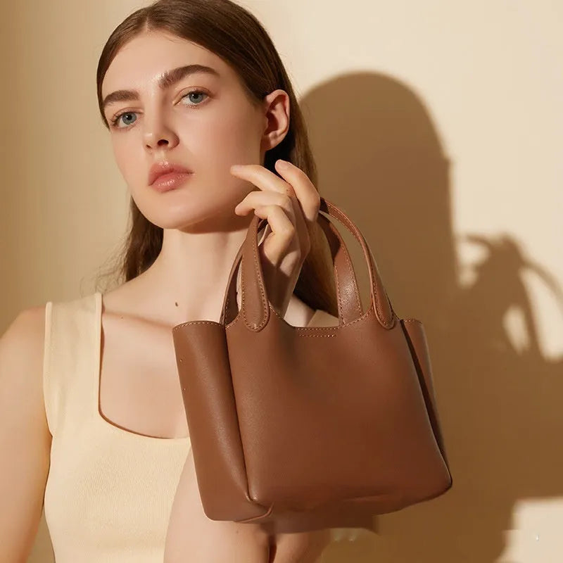 Genuine cattlehide leather cross body bucket bag in square vertical model with retro styling