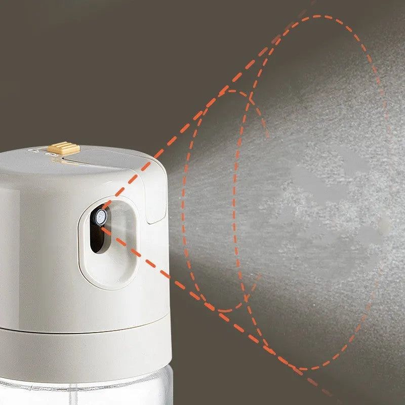 Warm grey glass oil sprayer and pourer bottle with switchable cap and detachable nozzle.