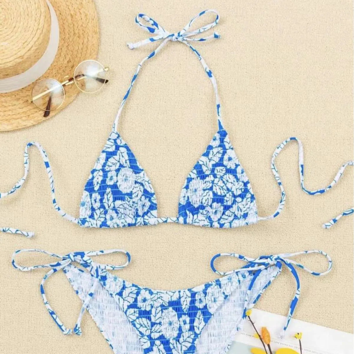 Women's floral print halter swimsuit set in light blue colour with briefs style