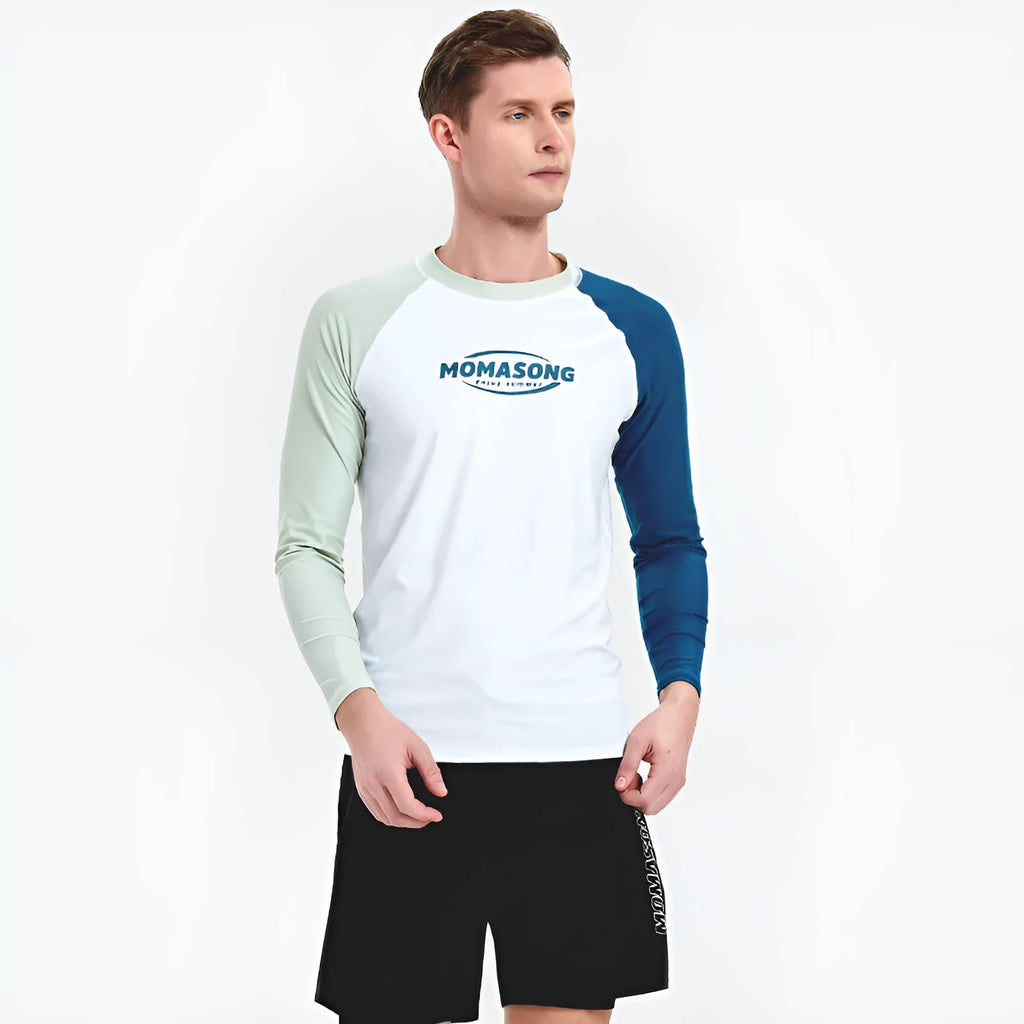 Men's white long-sleeved swim top with colour-matched beach swim trunks set on a beach.
