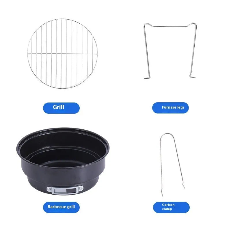 Small, round, folding metal ice stove grill with mesh top and legs, set up for outdoor use.