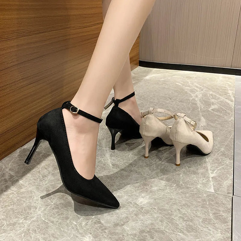 Women's black and creamy white stiletto heel pump shoes with an ankle buckle, shown in 5cm and 8cm heel heights.