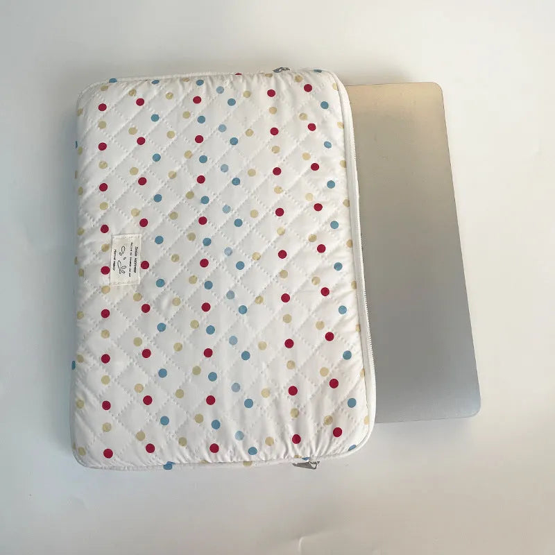 Polka dot patterned polyester laptop bag for women, shown in a solid colour with size options for 11, 13/14, and 15/15.6 inch laptops.
