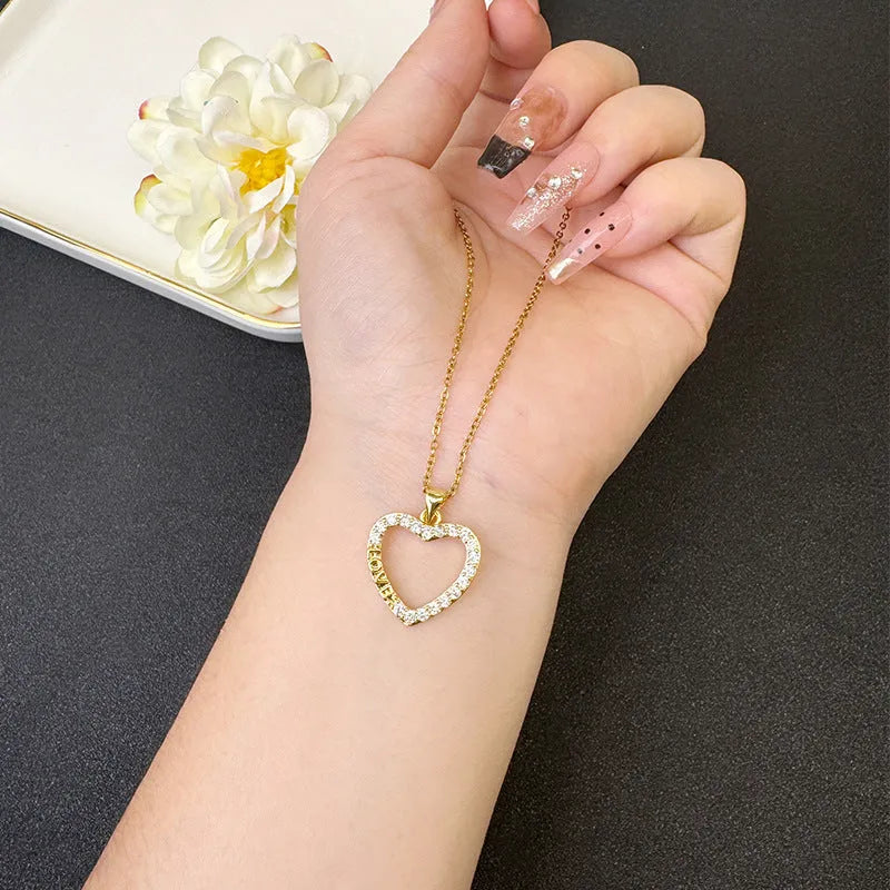 Gold light luxury necklace and earrings set with heart-shaped pendant and butterfly motif on copper alloy