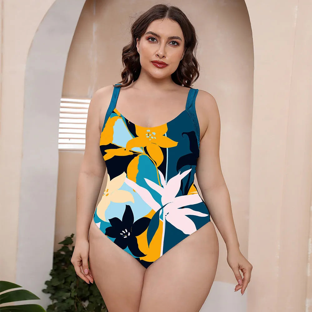 Conservative one-piece vest swimsuit with spaghetti straps and a vibrant floral print.