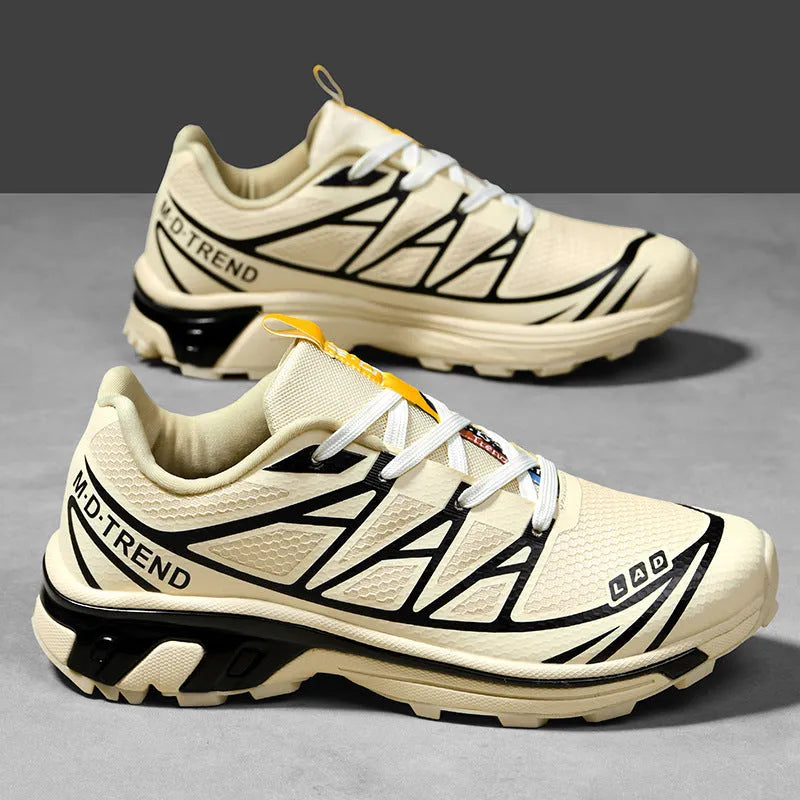 Low-top lace-up hiking shoe in khaki with a rubber sole and mesh lining detail.