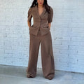 Brown polyester slim fit two-piece suit with long sleeves on a hanger
