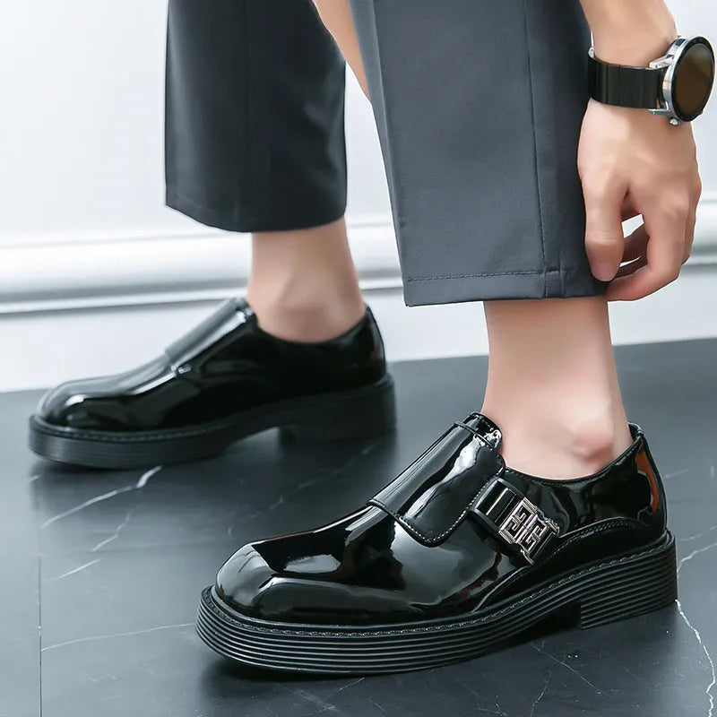 Men's glossy black platform loafers with hidden low heel, showing PU leather construction