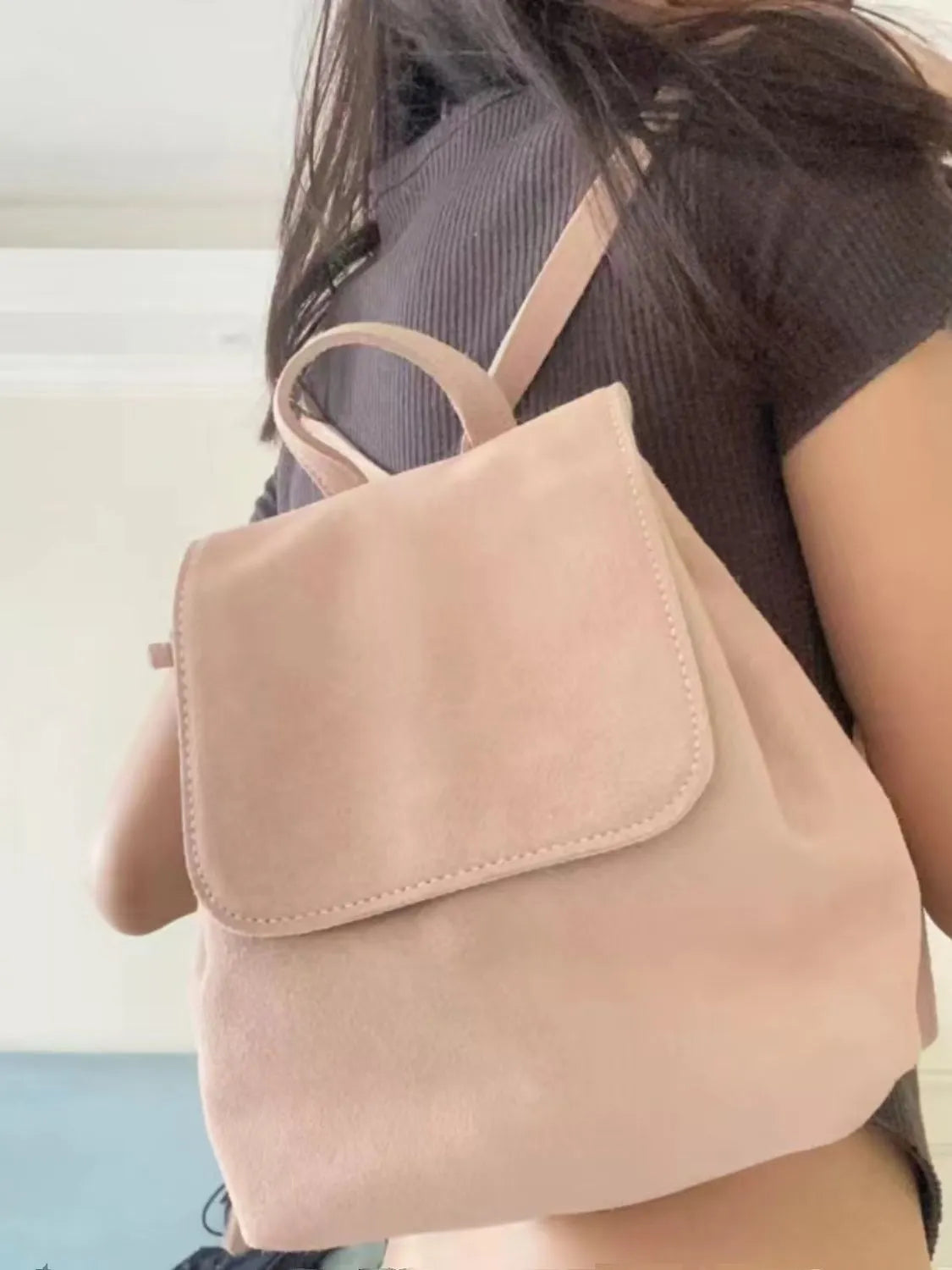 Retro suede girls backpack in brown with shoulder strap and sewing thread detailing
