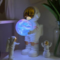 Spaceman starry sky projection lamp with Bluetooth speaker in decorative housing