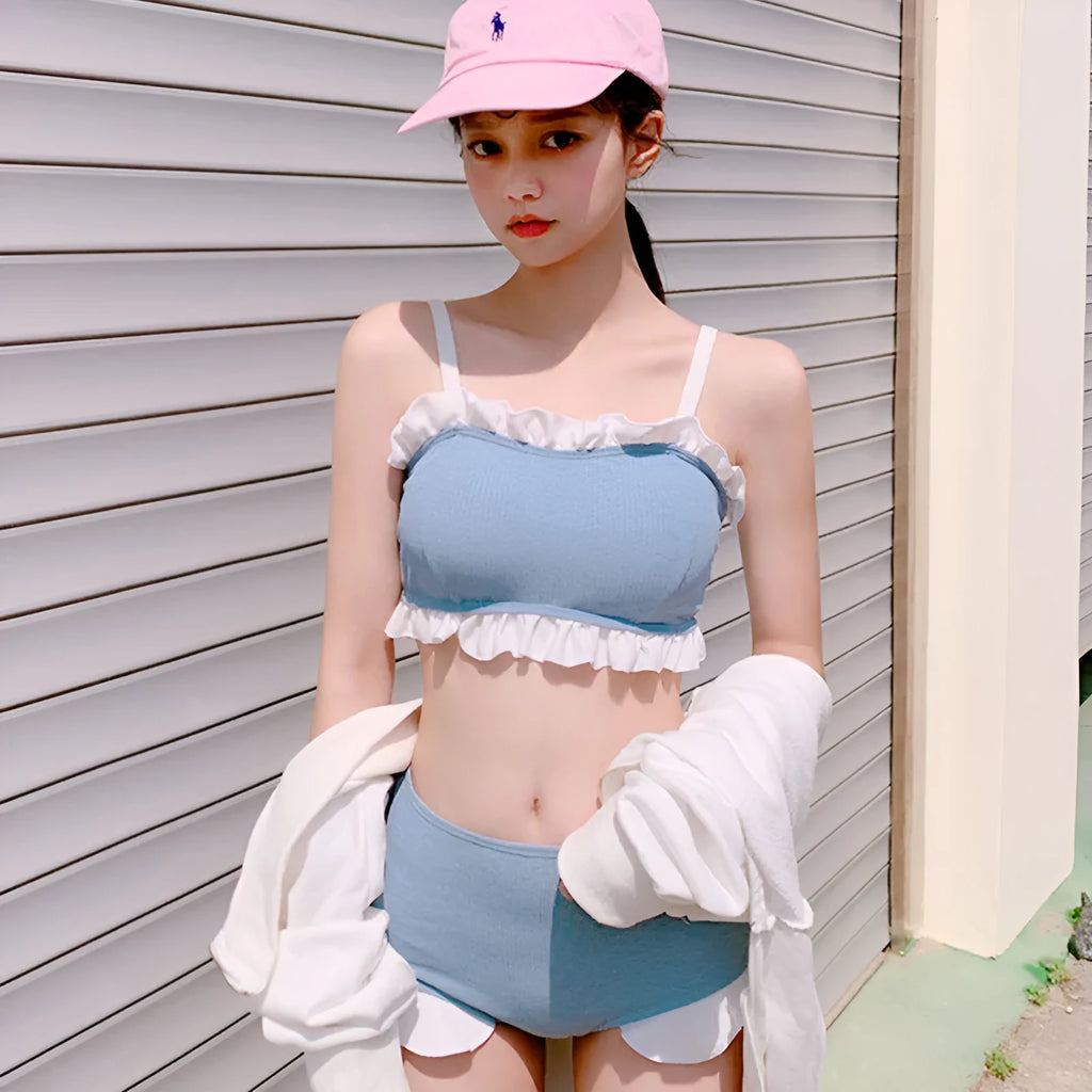 Solid colour conservative one-piece swimsuit for women with adjustable suspenders.