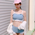 Solid colour conservative one-piece swimsuit for women with adjustable suspenders.
