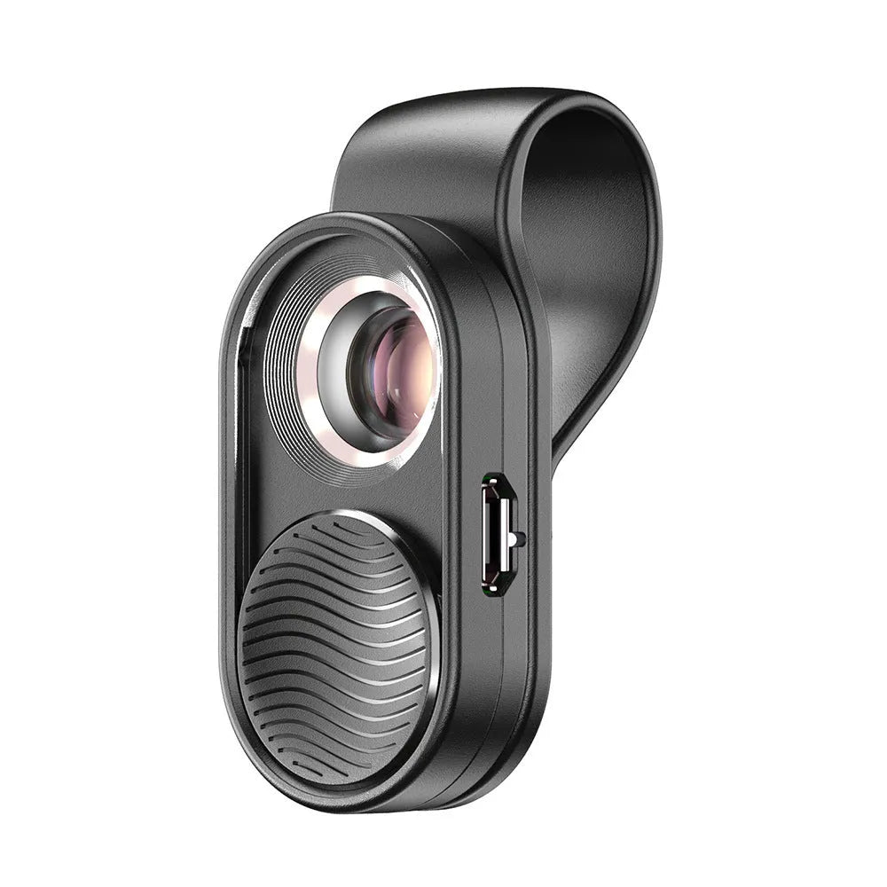 Black mobile magnification microscope with LED light clamped onto a smartphone showing 100x close-up view