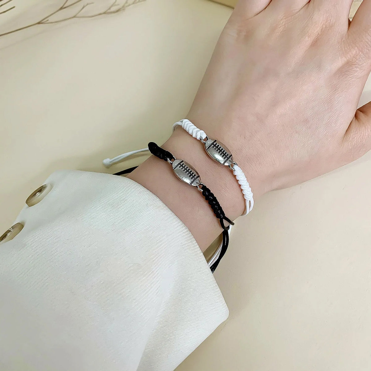 Black and white mixed color geometric bracelet with electroplated alloy finish on white background
