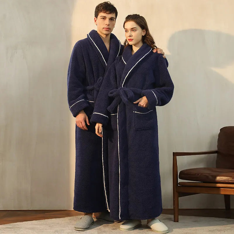 Man and woman wearing matching thick flannel bathrobes in winter colours like navy blue and cherry yellow.