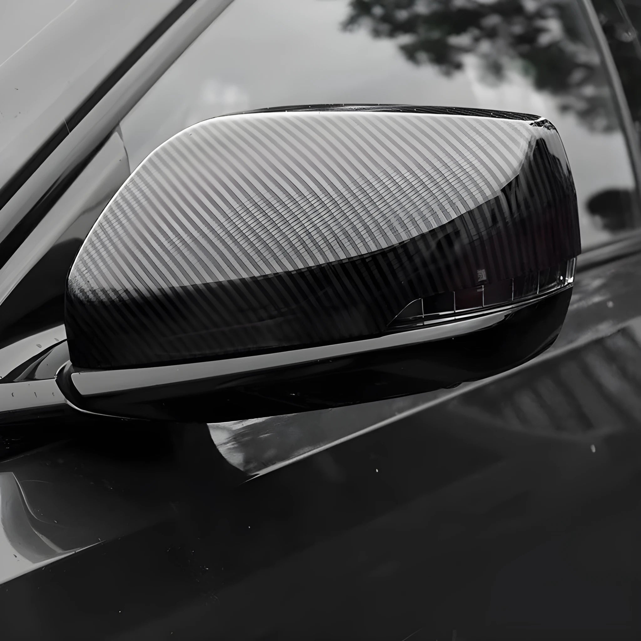 Pair of ABS plastic rearview mirror covers for Cadillac CT5 and CT6 cars in carbon fibre pattern finish.