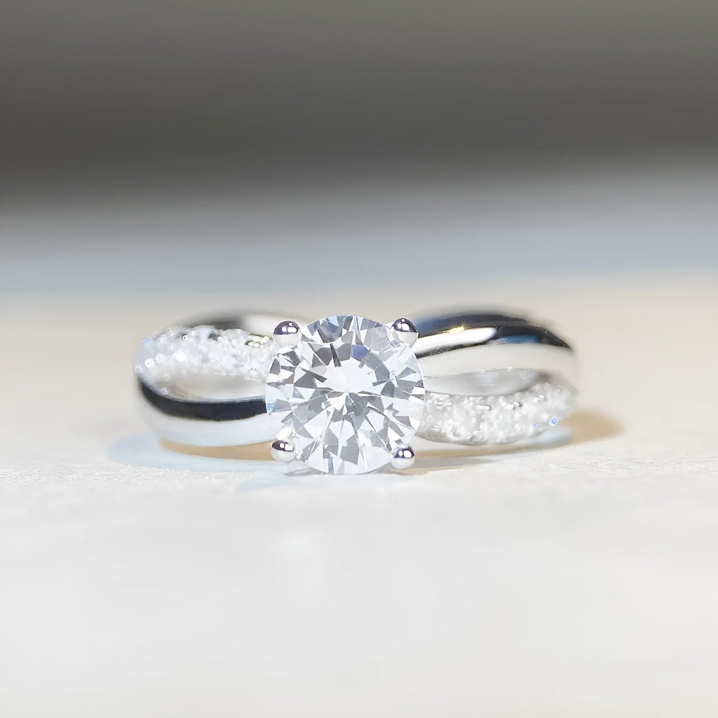 Silver ring with twisted band and 1 carat moissanite stone in four-claw setting