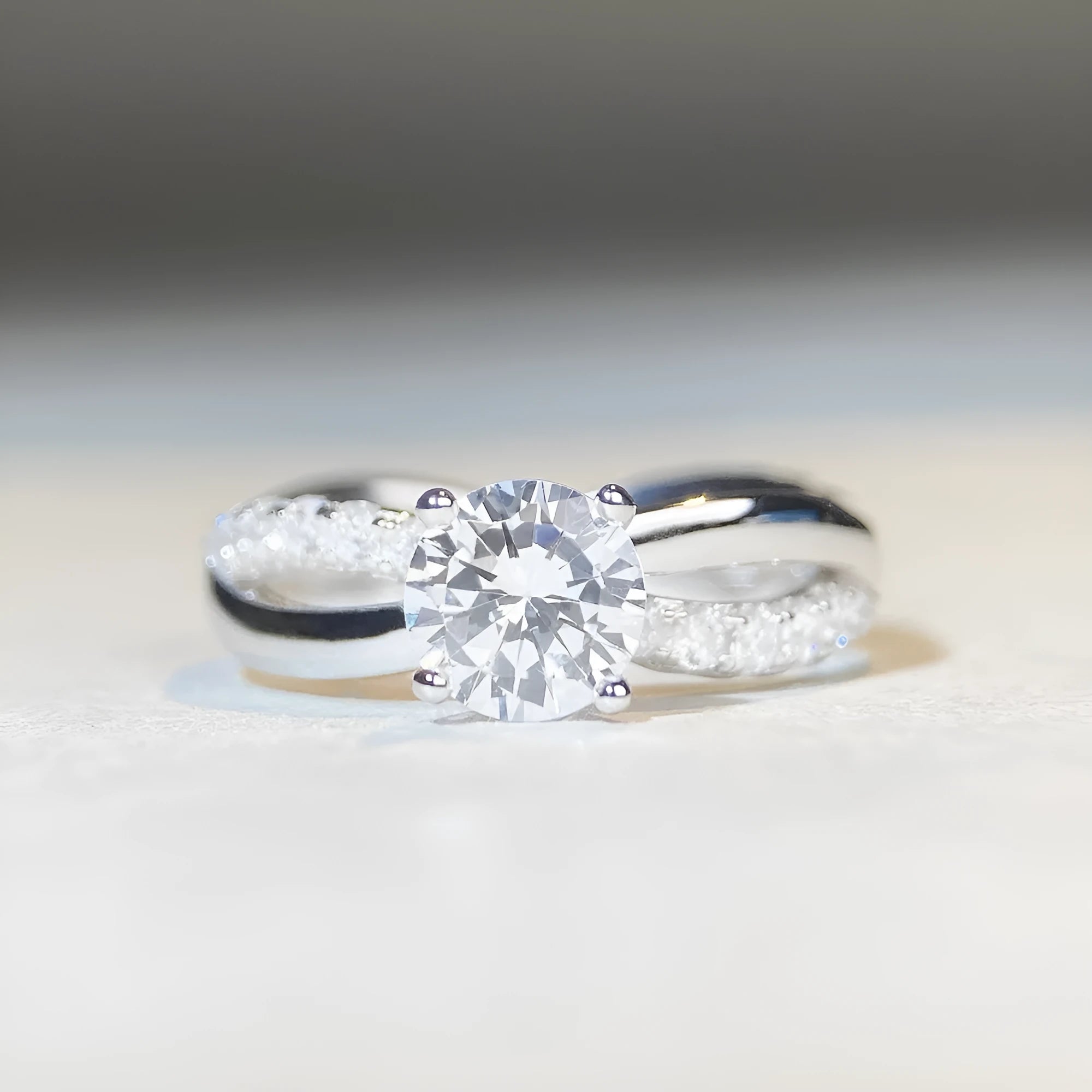 Silver ring with twisted band and 1 carat moissanite stone in four-claw setting