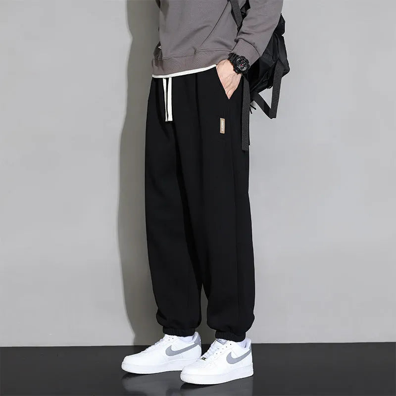 Men's loose fit casual sports trousers in gray, black, or army green with drawstring waist