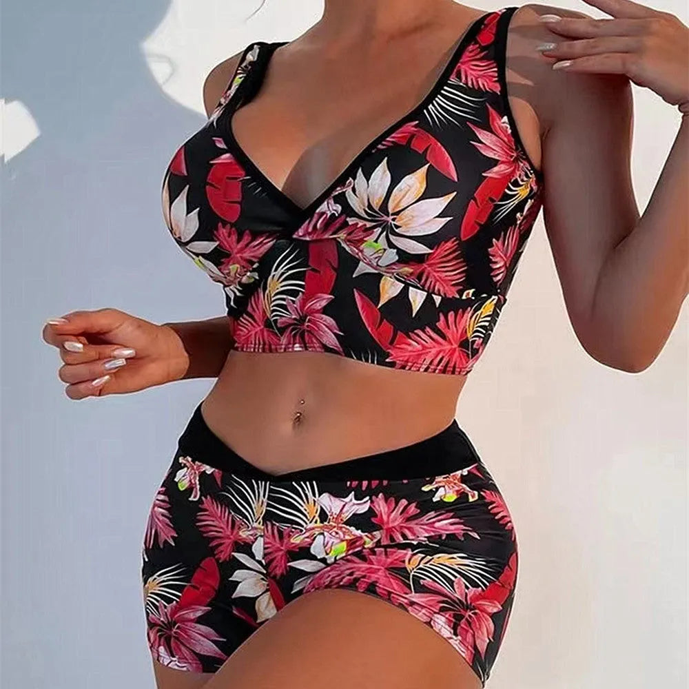Women's two-piece printed boxer swimsuit set in polyester on a mannequin.