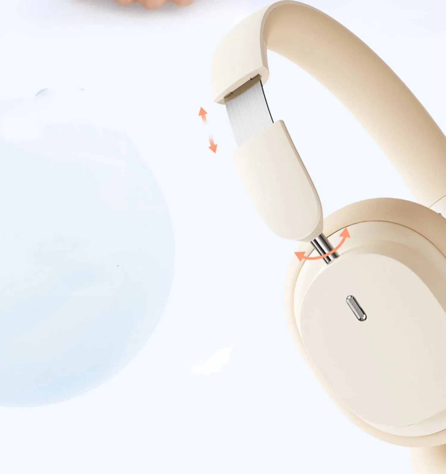 Beige and grey Bluetooth over-ear headphones with a Type-C charging cable on a table.