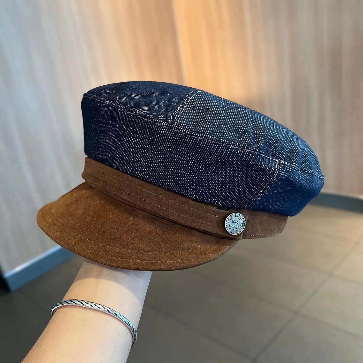 Dark blue denim octagonal newsboy hat with an adjustable fit for 54-58cm head sizes.
