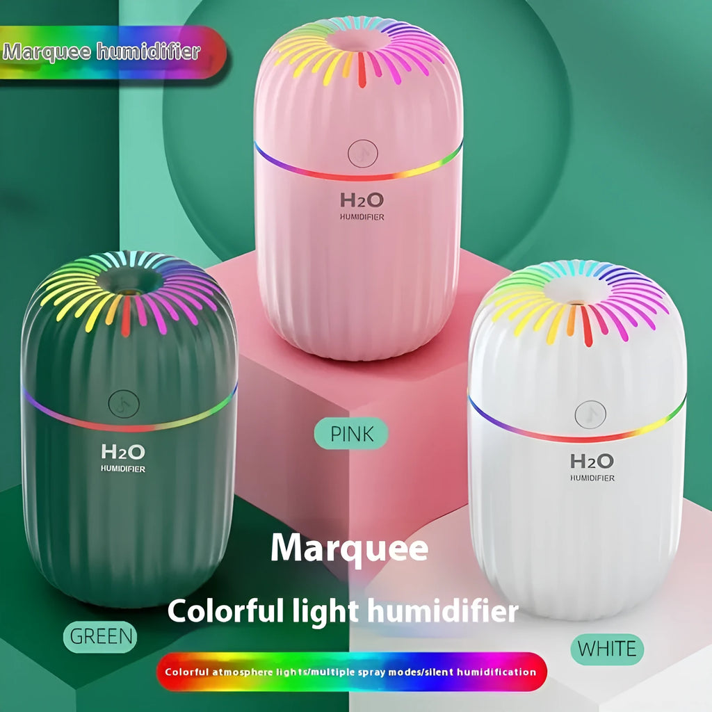 Small green animal-shaped USB aromatherapy humidifier on a desk
