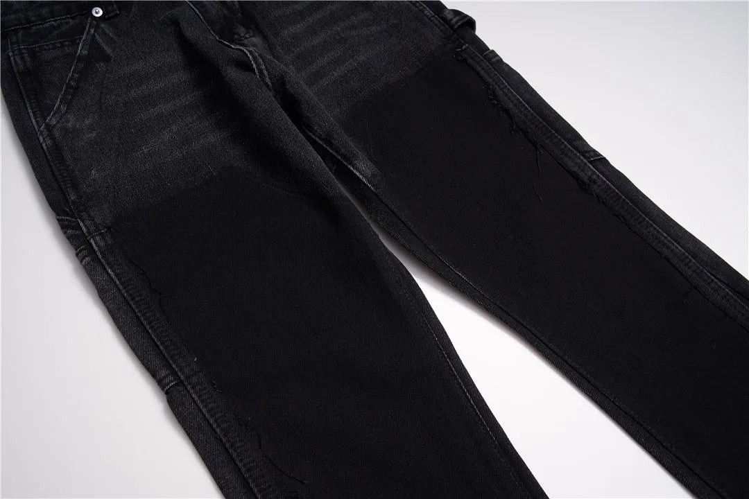 Black micro flared patchwork raw edge jeans on model showing loose straight tube fit