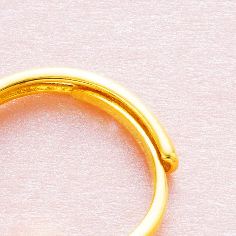 Women's Vietnam placer gold zircon ring in copper with adjustable opening on a hand
