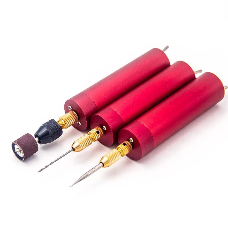 Small aluminium USB electric drill and grinder with three drill bits and cable on a white background.