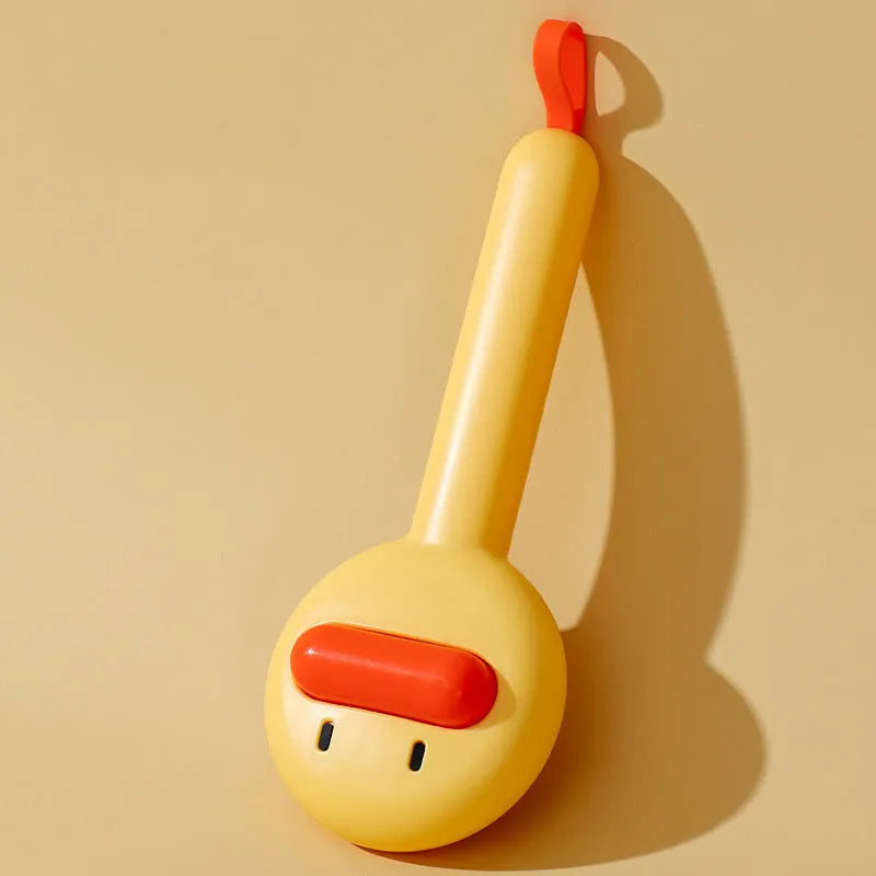 Small yellow duck-shaped pet grooming comb with needle pins for cats and dogs